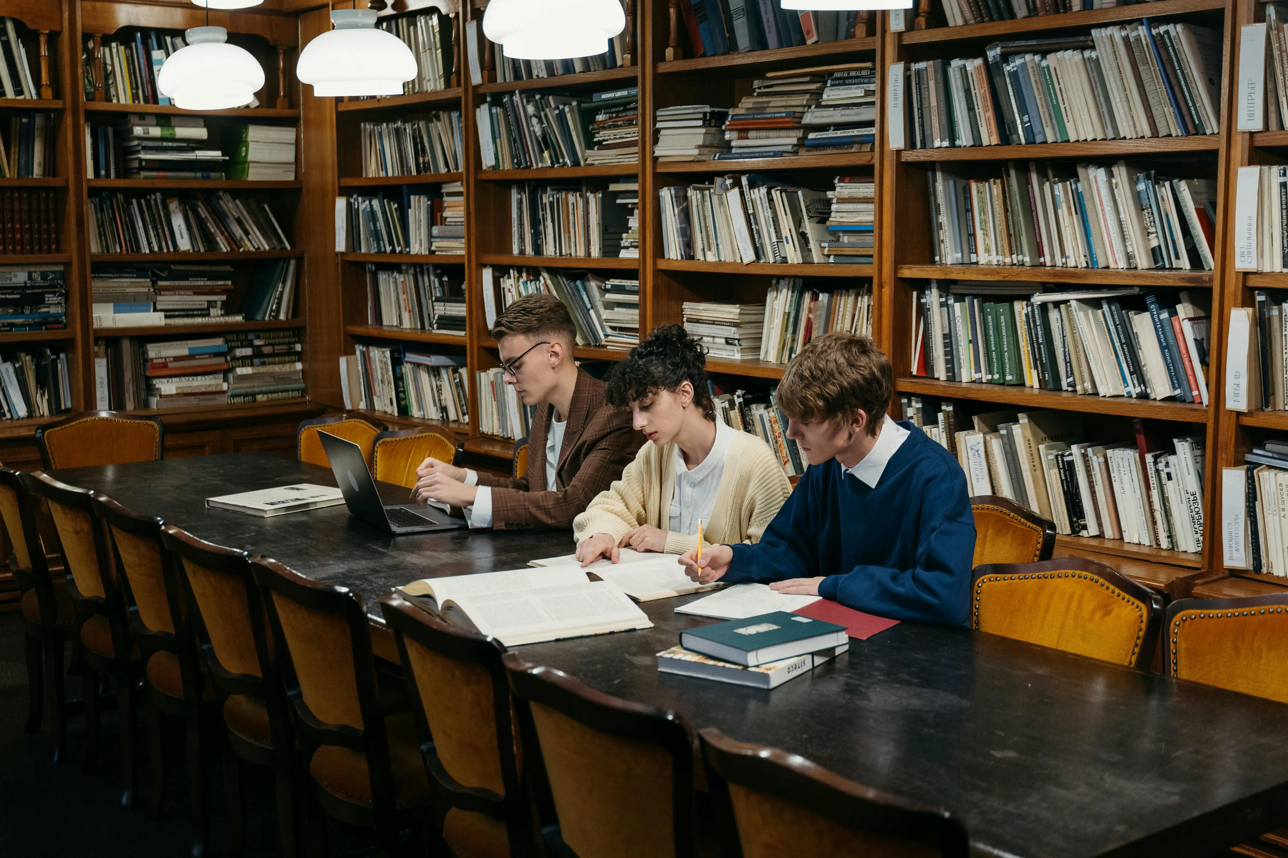 students stuyding at a library