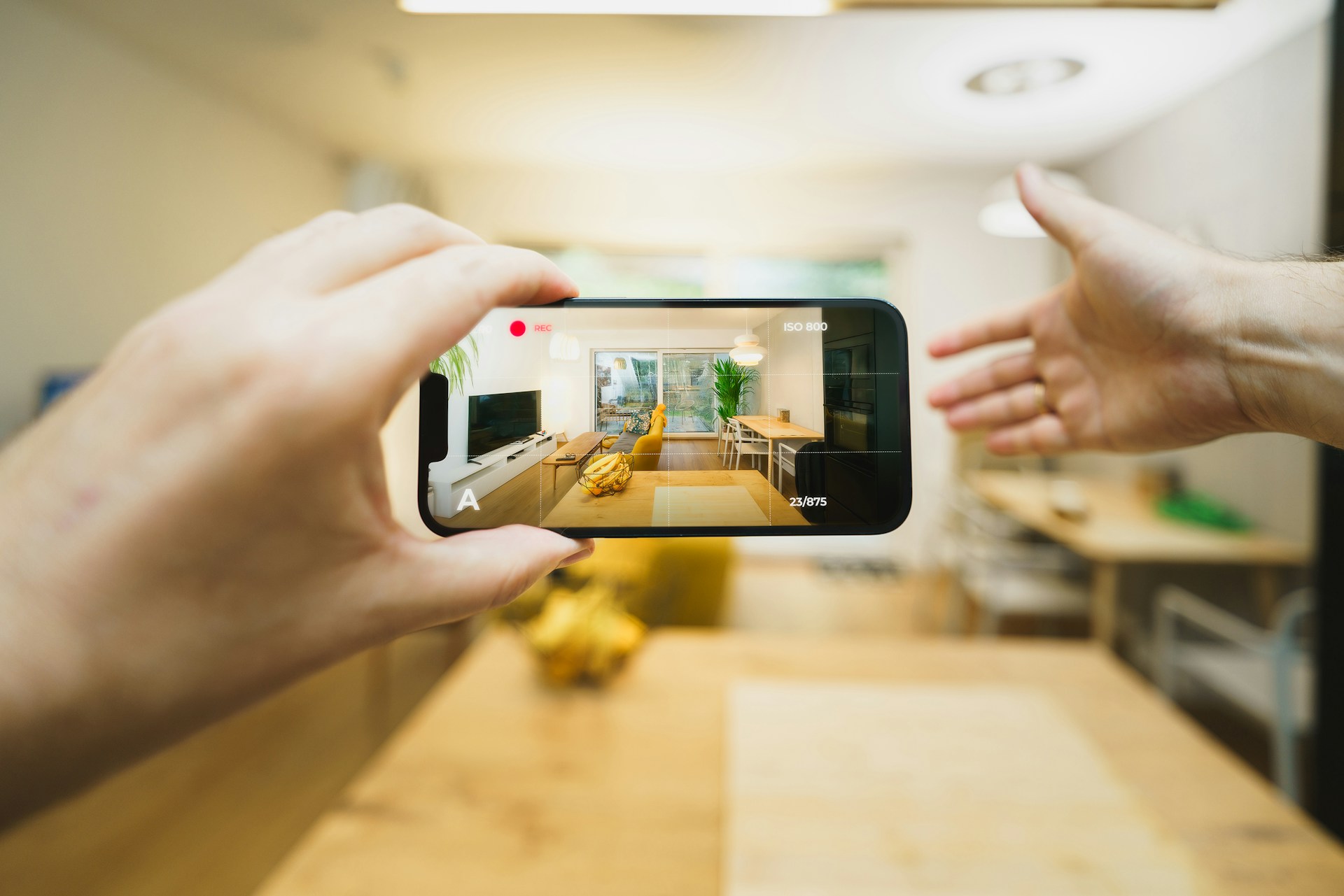 A phone showing a virtual tour of a room